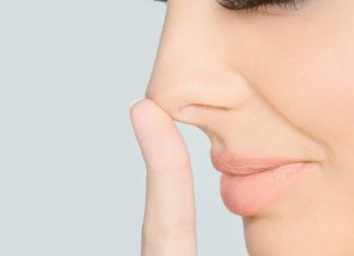 Why do we breathe harder through one nostril on our nose?