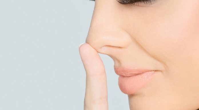 Why do we breathe harder through one nostril on our nose?