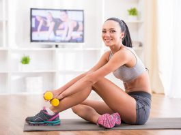 Fit woman does home workouts