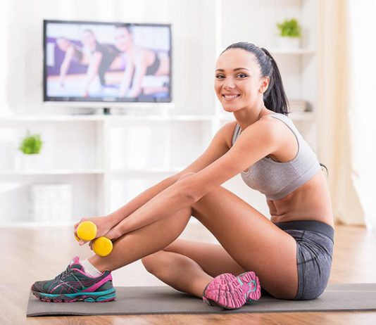 Fit woman does home workouts