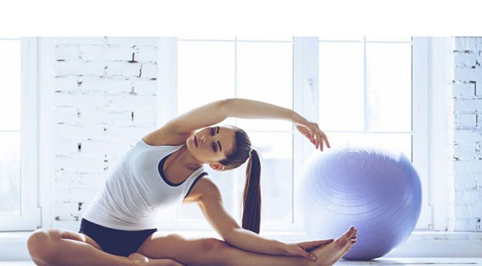The Fundamental Pilates Method Exercises A sportswoman doing pilates