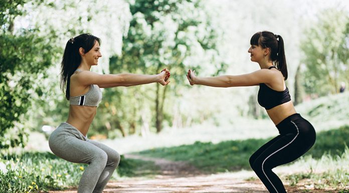 Two fit women warming up-cooling down