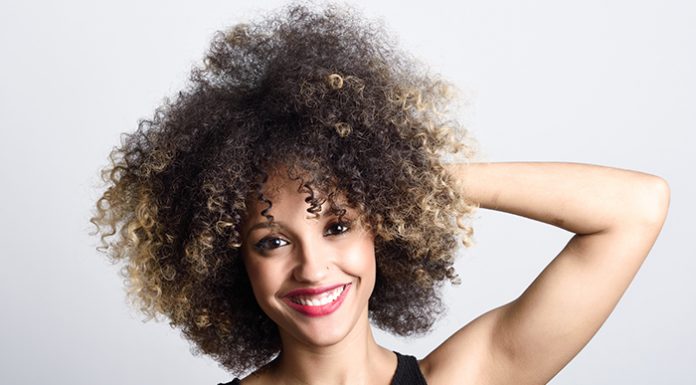 Beautiful smiling woman with curly hair