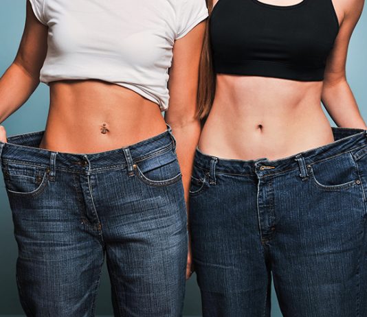Two fit women in loose jeans